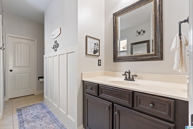 bathroom with tile patterned flooring and vanity