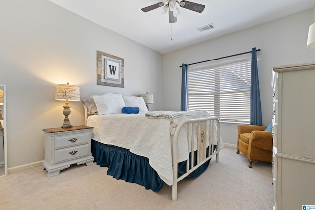 bedroom featuring light carpet and ceiling fan