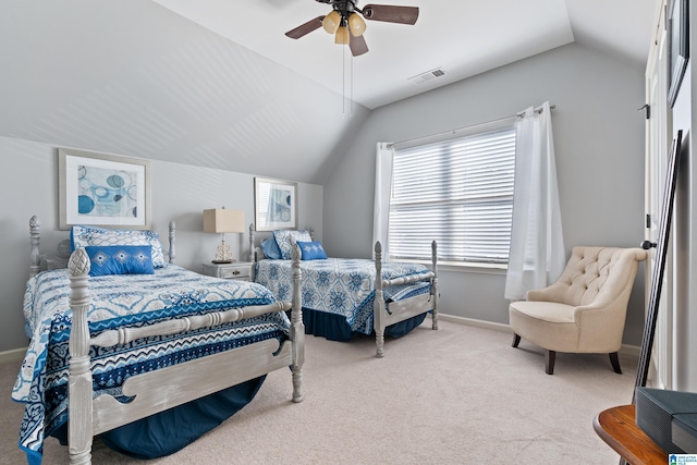 bedroom featuring carpet, ceiling fan, and vaulted ceiling