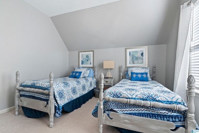 bedroom featuring carpet and lofted ceiling