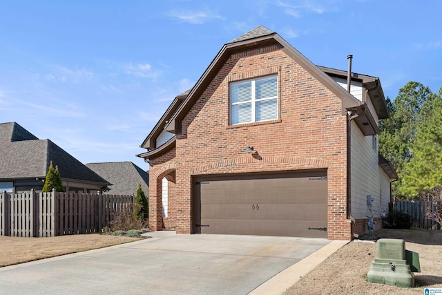 view of side of home featuring a garage