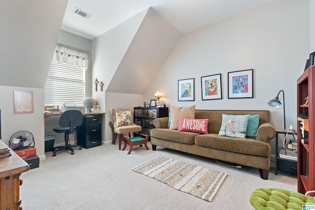 carpeted office featuring vaulted ceiling