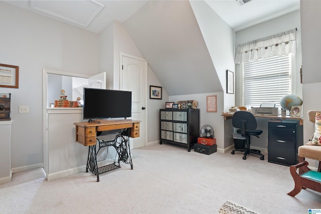 carpeted office space with vaulted ceiling