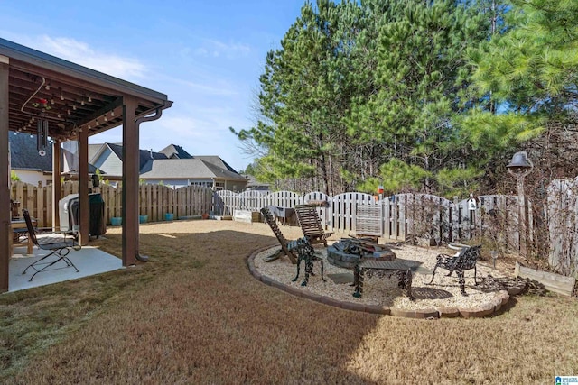 view of yard with a patio area and an outdoor fire pit