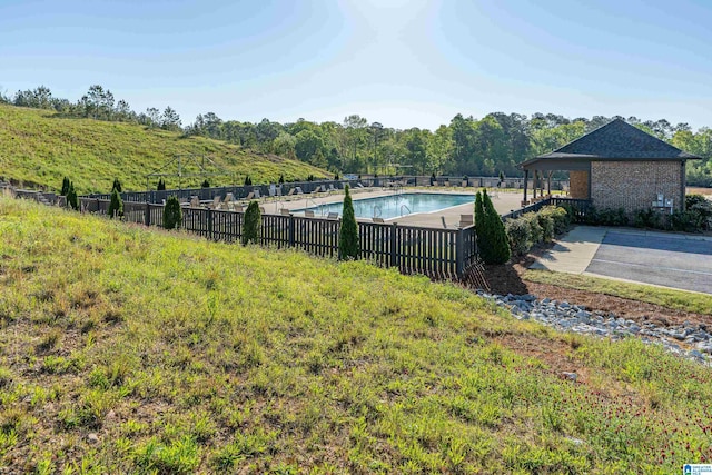 view of yard featuring a community pool