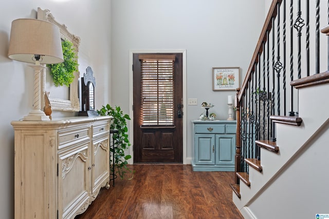 foyer with dark hardwood / wood-style floors