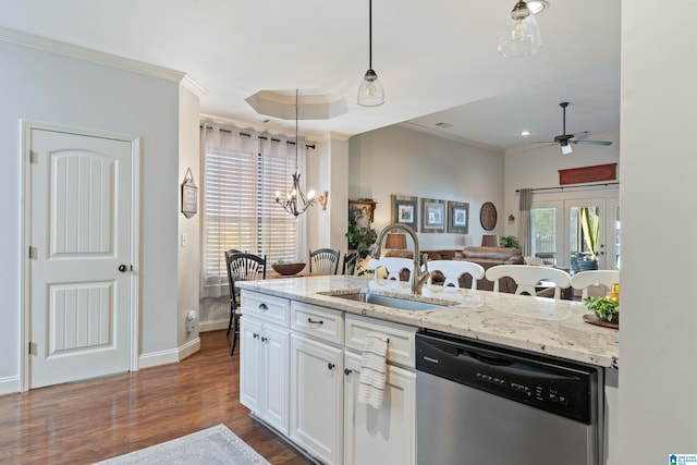 kitchen with ornamental molding, sink, pendant lighting, dishwasher, and white cabinetry