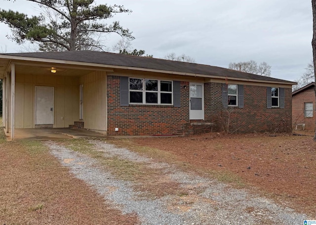 single story home featuring a carport