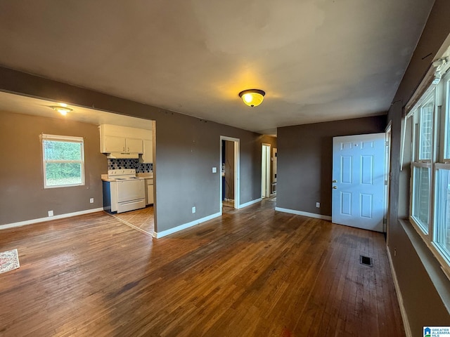 unfurnished living room with light hardwood / wood-style flooring