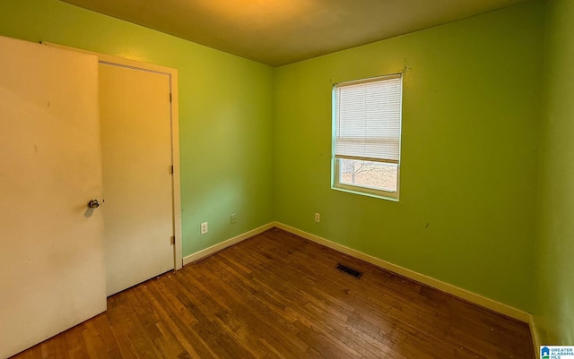 spare room featuring hardwood / wood-style floors