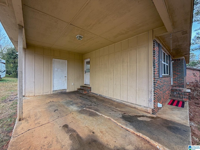 property entrance featuring a patio