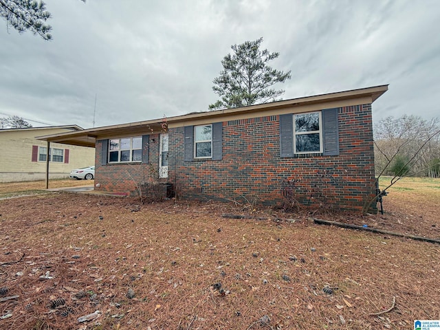 view of front of home with a carport