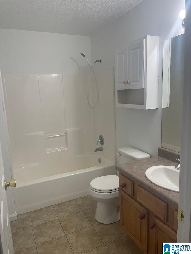 full bathroom with vanity, bathtub / shower combination, tile patterned floors, toilet, and a textured ceiling