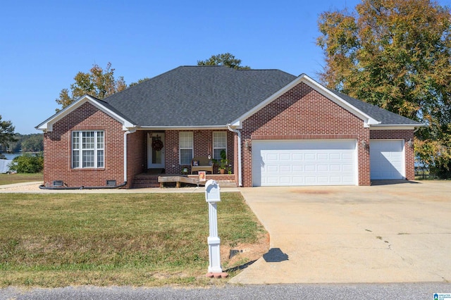 ranch-style house with a garage and a front lawn