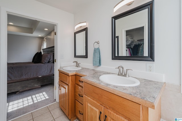 bathroom with tile patterned flooring and vanity