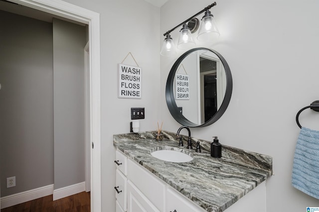 bathroom with hardwood / wood-style floors and vanity