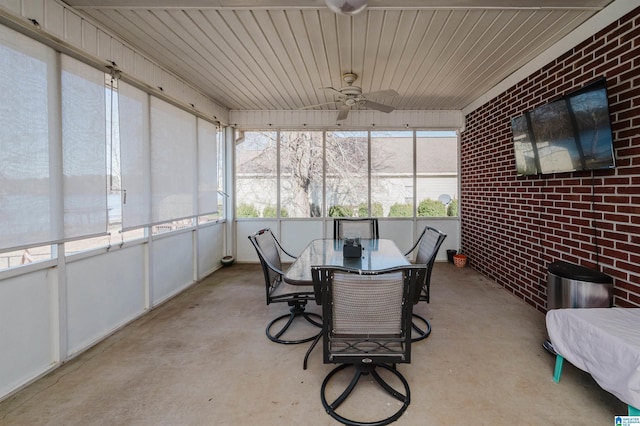 sunroom / solarium featuring ceiling fan