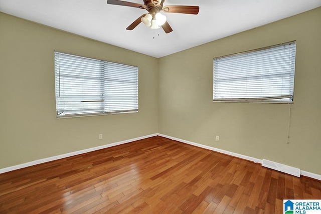 empty room featuring ceiling fan and wood-type flooring