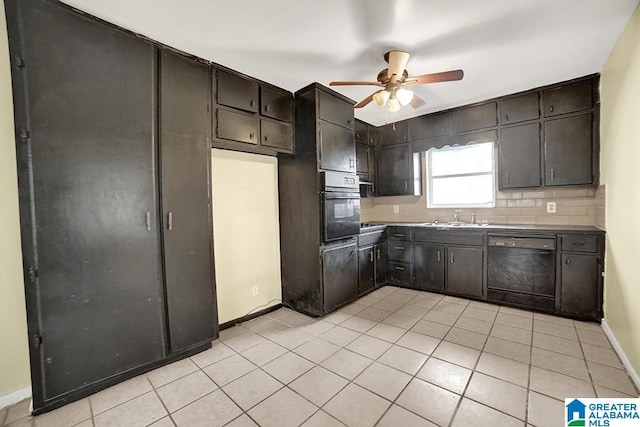 kitchen with dark brown cabinetry, ceiling fan, sink, black dishwasher, and oven