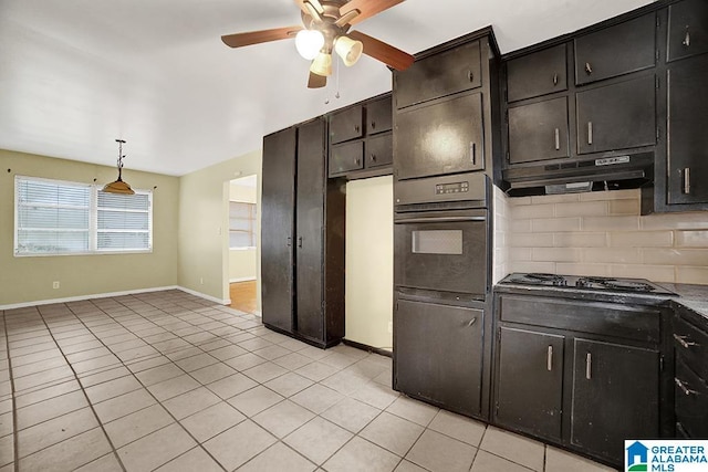 kitchen featuring ceiling fan, hanging light fixtures, gas cooktop, black oven, and light tile patterned floors