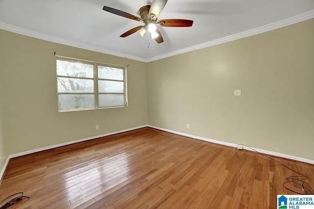 unfurnished room featuring hardwood / wood-style floors, ceiling fan, and crown molding