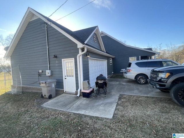 view of side of property featuring a garage