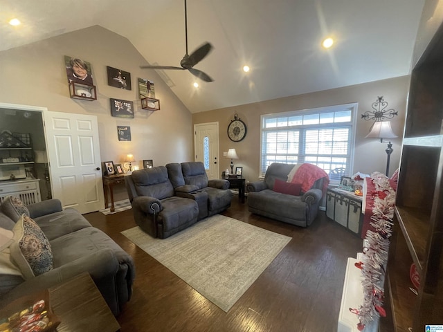 living room with dark hardwood / wood-style floors, high vaulted ceiling, and ceiling fan