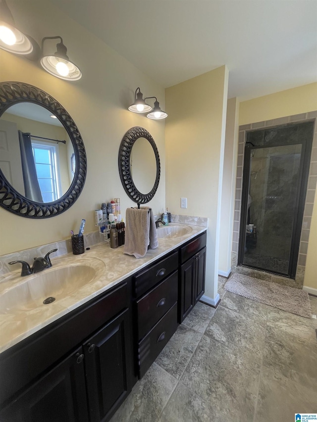 bathroom featuring vanity and a shower with shower door