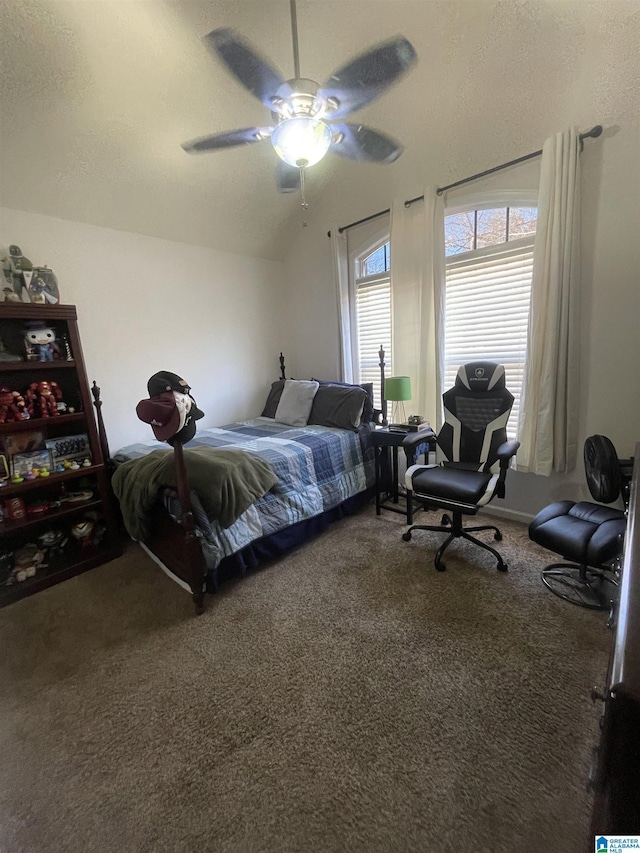 carpeted bedroom featuring ceiling fan and lofted ceiling