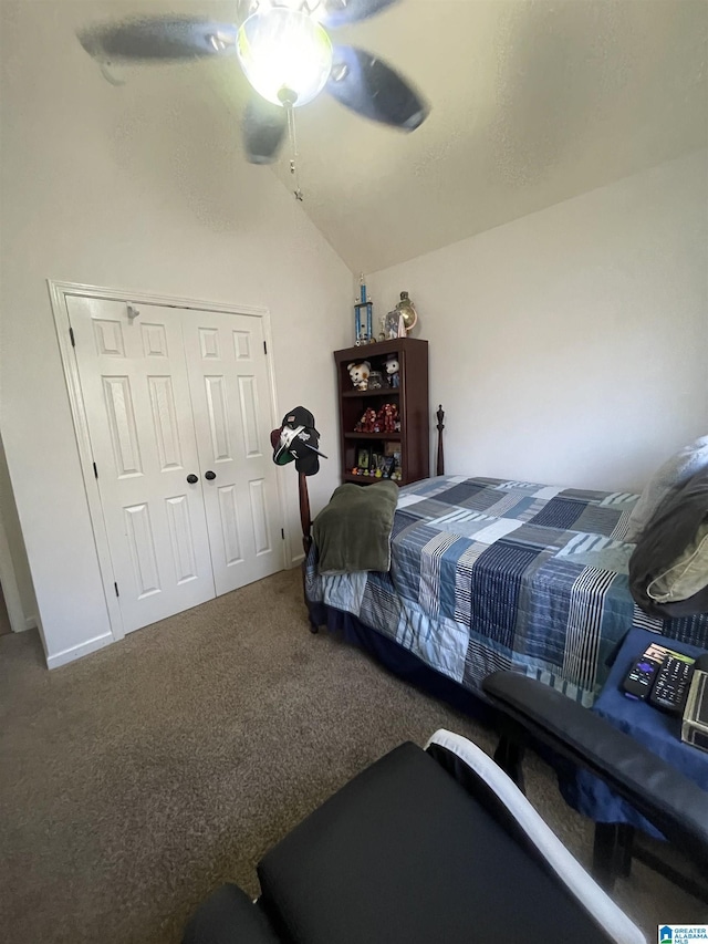 bedroom with ceiling fan, a closet, carpet floors, and vaulted ceiling