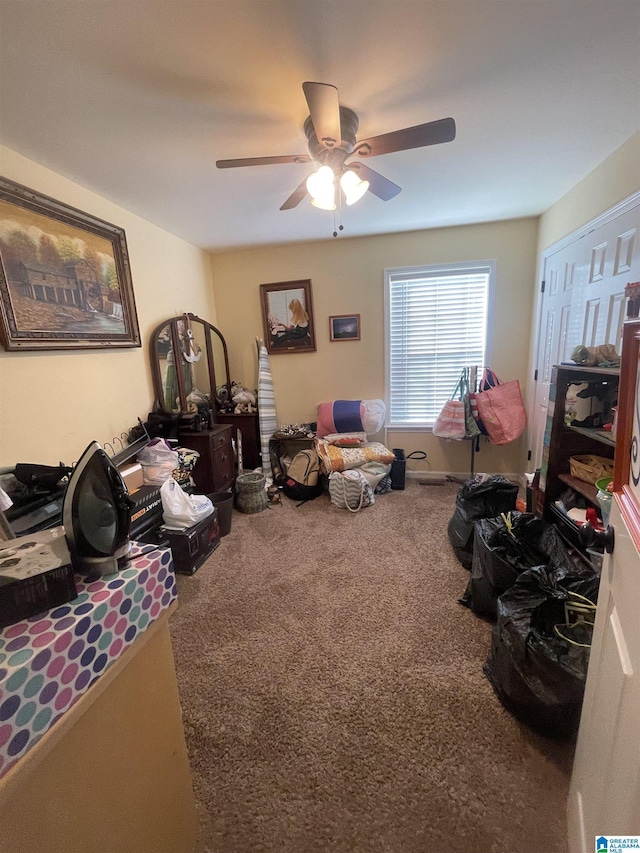 interior space with carpet flooring and ceiling fan