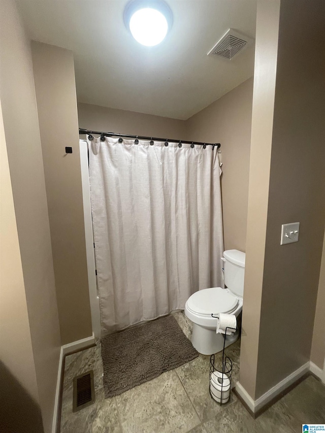 bathroom featuring toilet