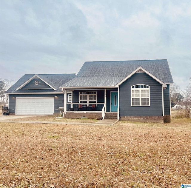 single story home with covered porch and a garage