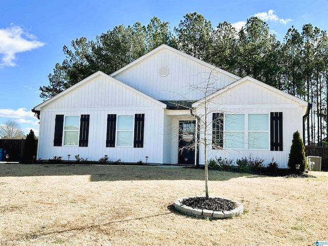 modern inspired farmhouse with a front yard