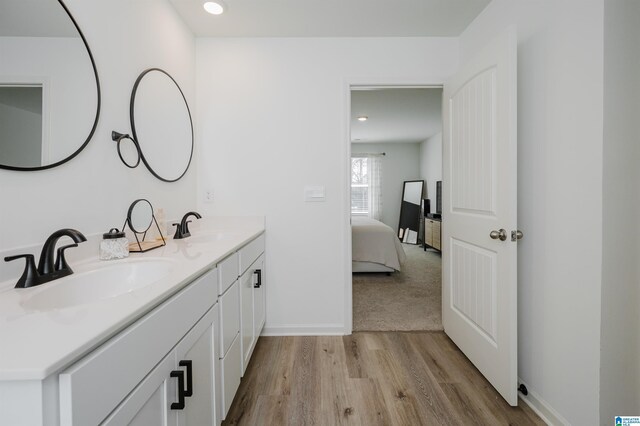 bathroom featuring vanity and wood-type flooring