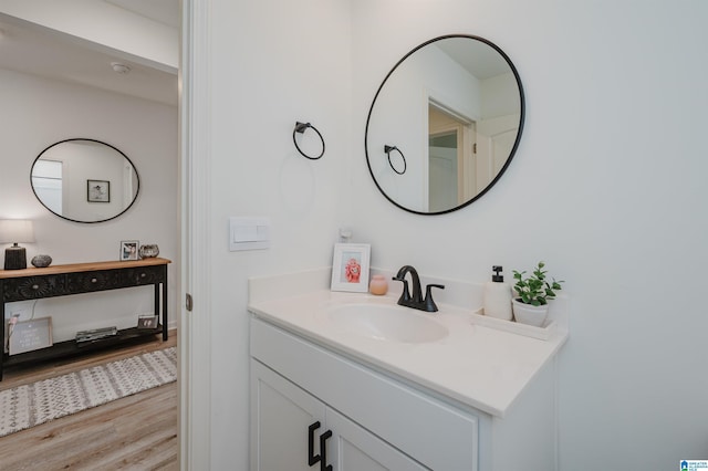 bathroom featuring wood-type flooring and vanity