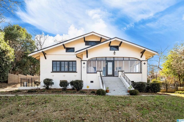 view of front of home with a front lawn