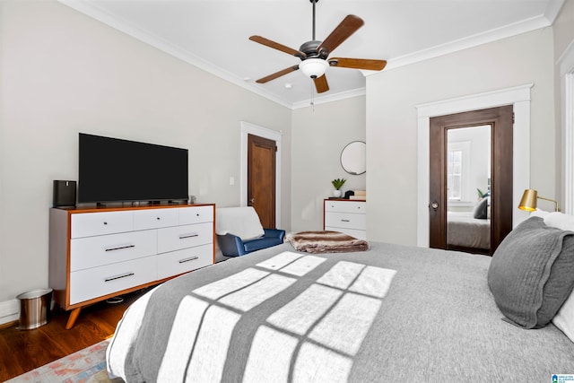 bedroom with ceiling fan, crown molding, and dark wood-type flooring