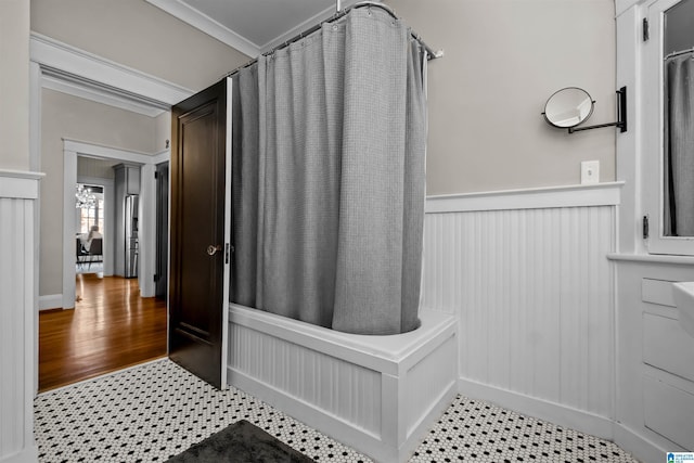 bathroom featuring shower / tub combo with curtain and ornamental molding