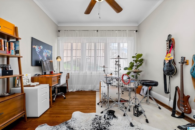 office space with ceiling fan, crown molding, a healthy amount of sunlight, and dark hardwood / wood-style floors