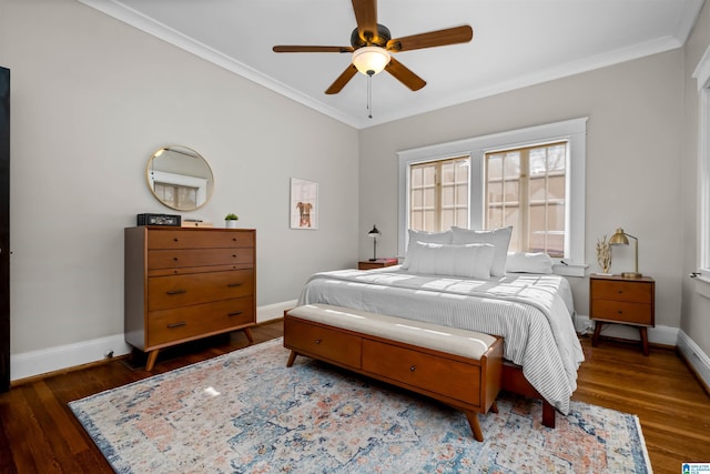 bedroom with ceiling fan, dark hardwood / wood-style flooring, and ornamental molding