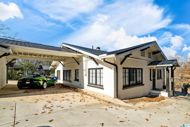 view of side of home featuring a carport