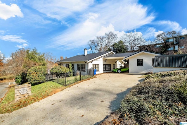 view of front of home with a carport