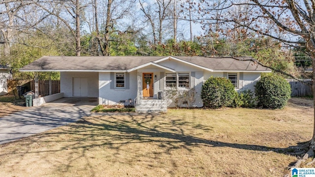 ranch-style home with a carport and a front lawn