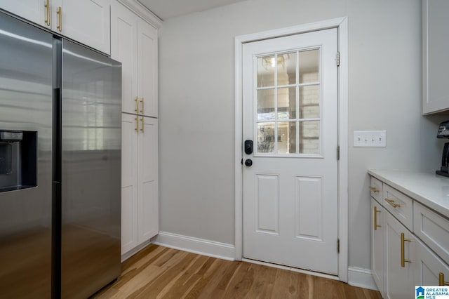 doorway to outside featuring light wood-type flooring