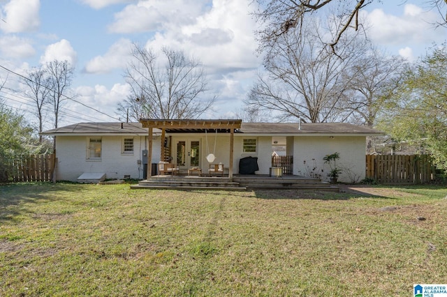 back of house with a pergola, a yard, and a wooden deck