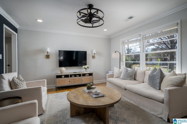 living room with ceiling fan, hardwood / wood-style floors, and ornamental molding