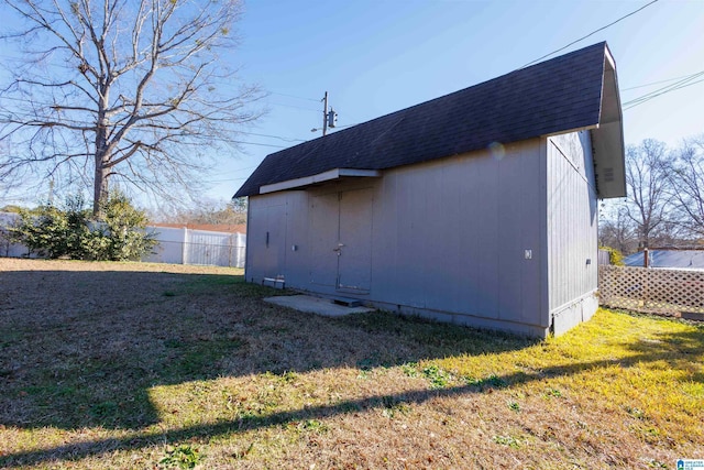 view of side of home with a lawn