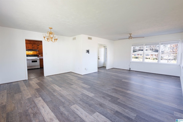 unfurnished living room featuring ceiling fan with notable chandelier and dark hardwood / wood-style flooring