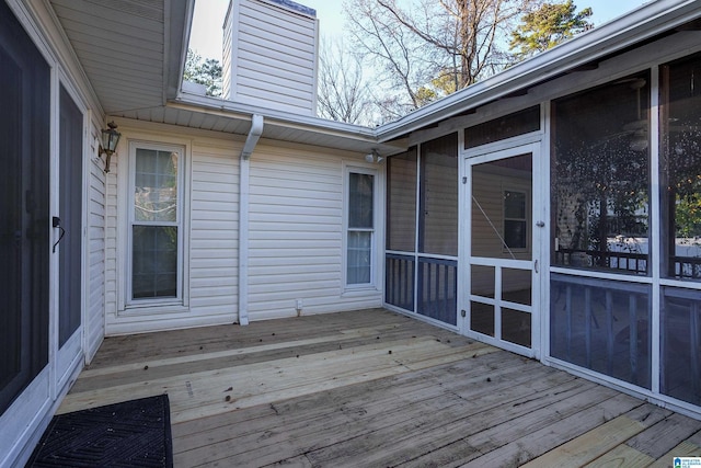 wooden terrace with a sunroom